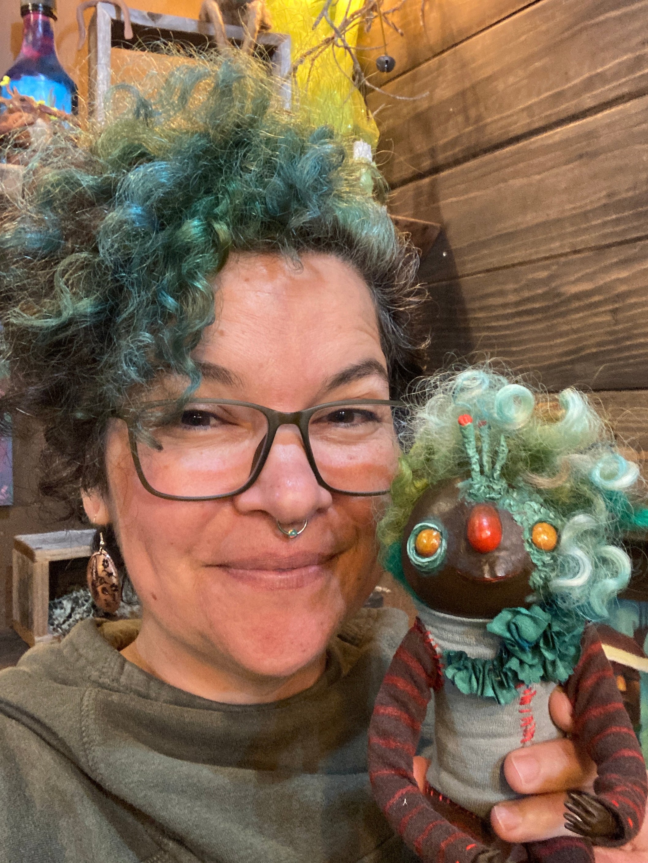 Person with art doll that they love